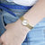 天梭(TISSOT)手表 时尚系列石英女表T058.009.33.031.00 金色第4张高清大图