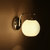 美吉特时尚简约壁灯现代韩式圆形玻璃床头灯卧室墙壁灯过道阳台等(白色双头 带5w光源)第2张高清大图