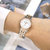 天梭女表（TISSOT）瑞士手表 力洛克系列时尚日历全自动机械表钢带女士腕表T41.1.183.33(间玫瑰金罗马)第4张高清大图