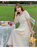2021夏款韩版女装复古珍珠扣抽褶V领公主袖显瘦连衣裙(杏色 L)第7张高清大图